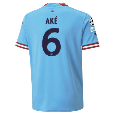 Kids' Manchester City Home Jersey 22/23 with AKÉ 6 printing