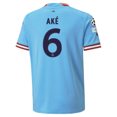 Kids' Manchester City Home Jersey 2022/23 with AKÉ 6 printing