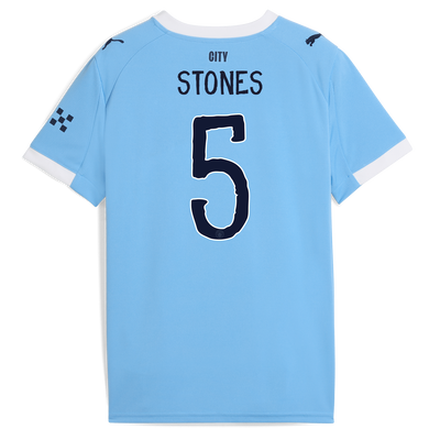 Camiseta local para niños del Manchester City 2025/26 con estampado STONES 5