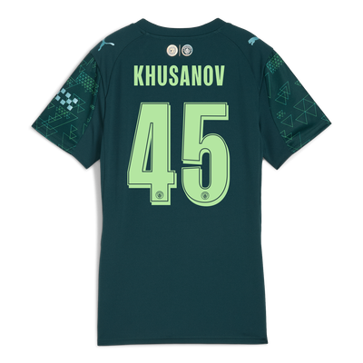 Camiseta para mujer Manchester City EA SPORTS FC 2025/26 con estampado KHUSANOV 45