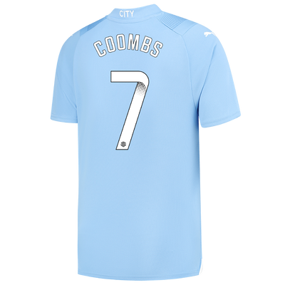 Camiseta 1ª Equipación Manchester City 2023/24 con estampado de COOMBS 7